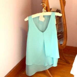 Asymmetrical sleeveless tunic